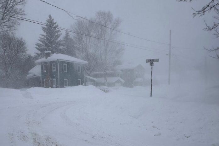 Wind gusts lift snowdrifts in Lowville, New York (Associated Press/Cara Anna)